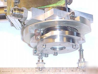 Front/back laser mirror mount / vacuum valve assemblies