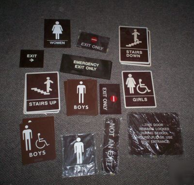 Lot plastic signs exit boys girls men bathroom stairs