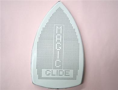 Teflon ironing shoe for gravity feed bottle steam irons